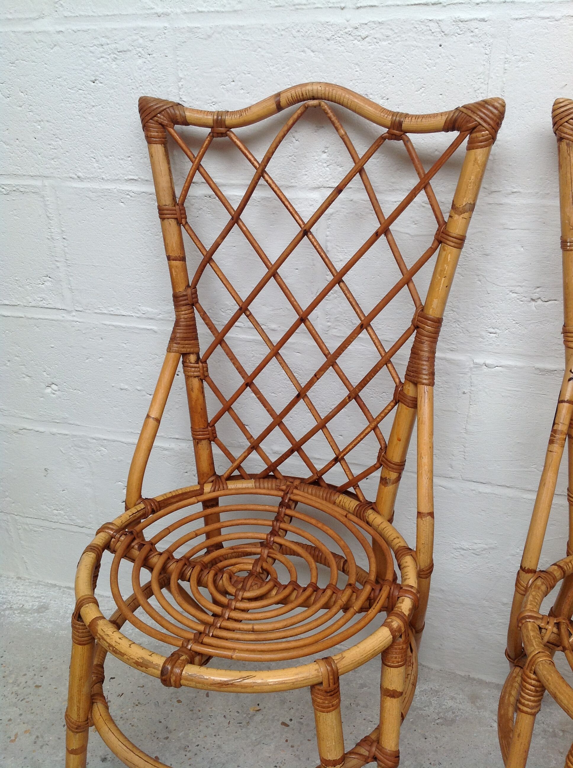 Pair of rattan chairs by Louis Sognot