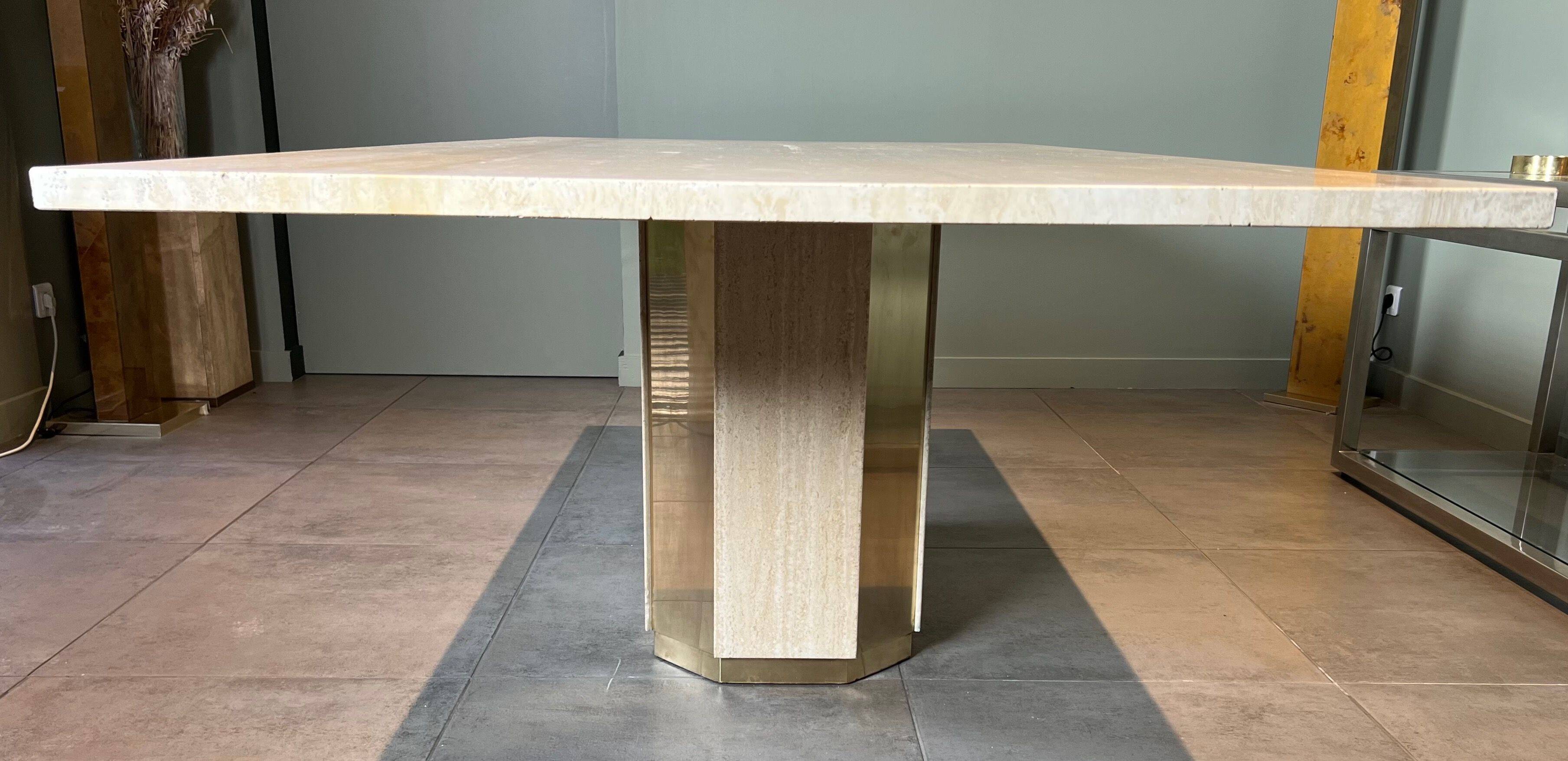 Dining table in travertine and brass. French work. Around 1970.