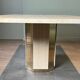 Dining table in travertine and brass. French work. Around 1970.