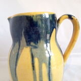 Yellow, blue and green rustic pitcher