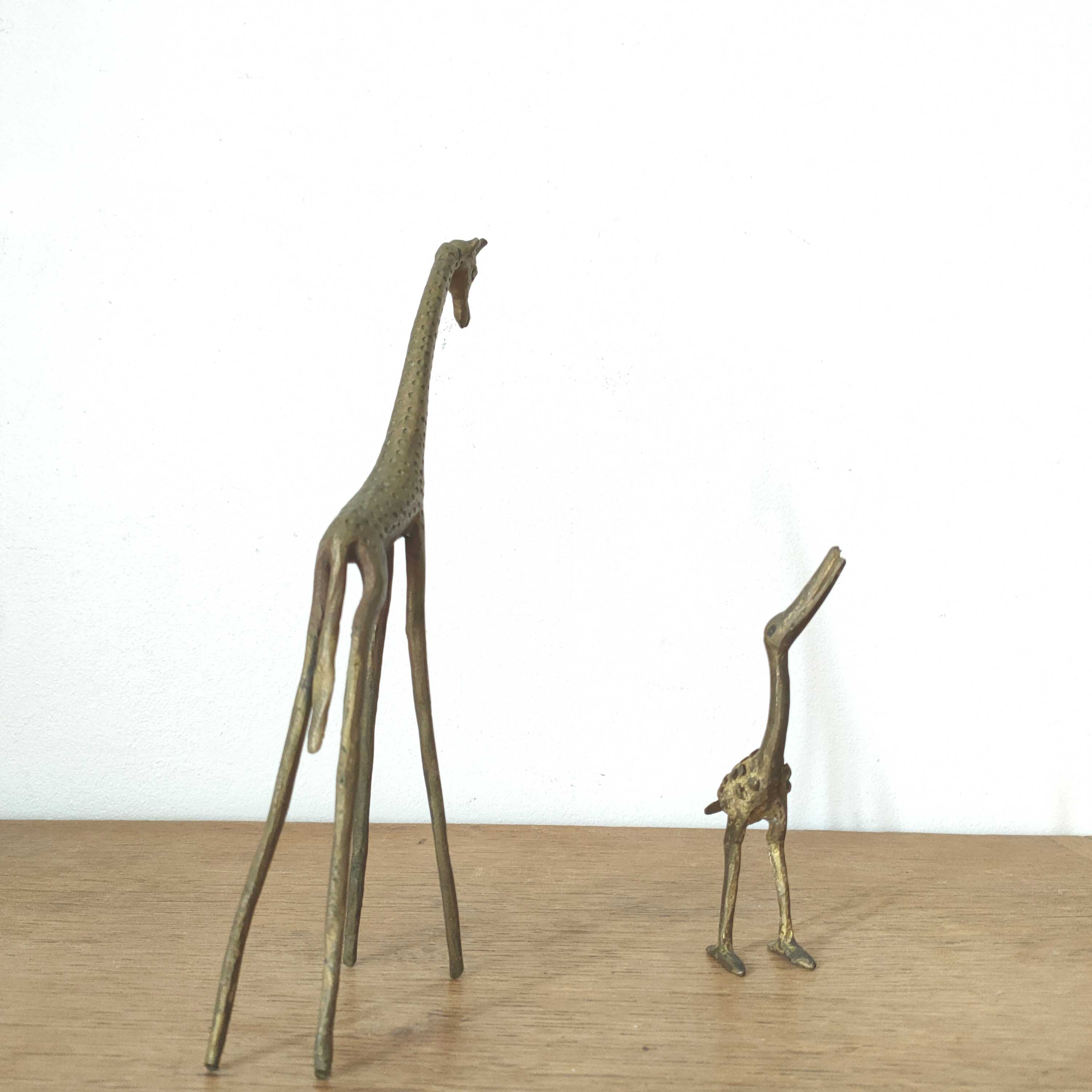 Giraffe and brass bird