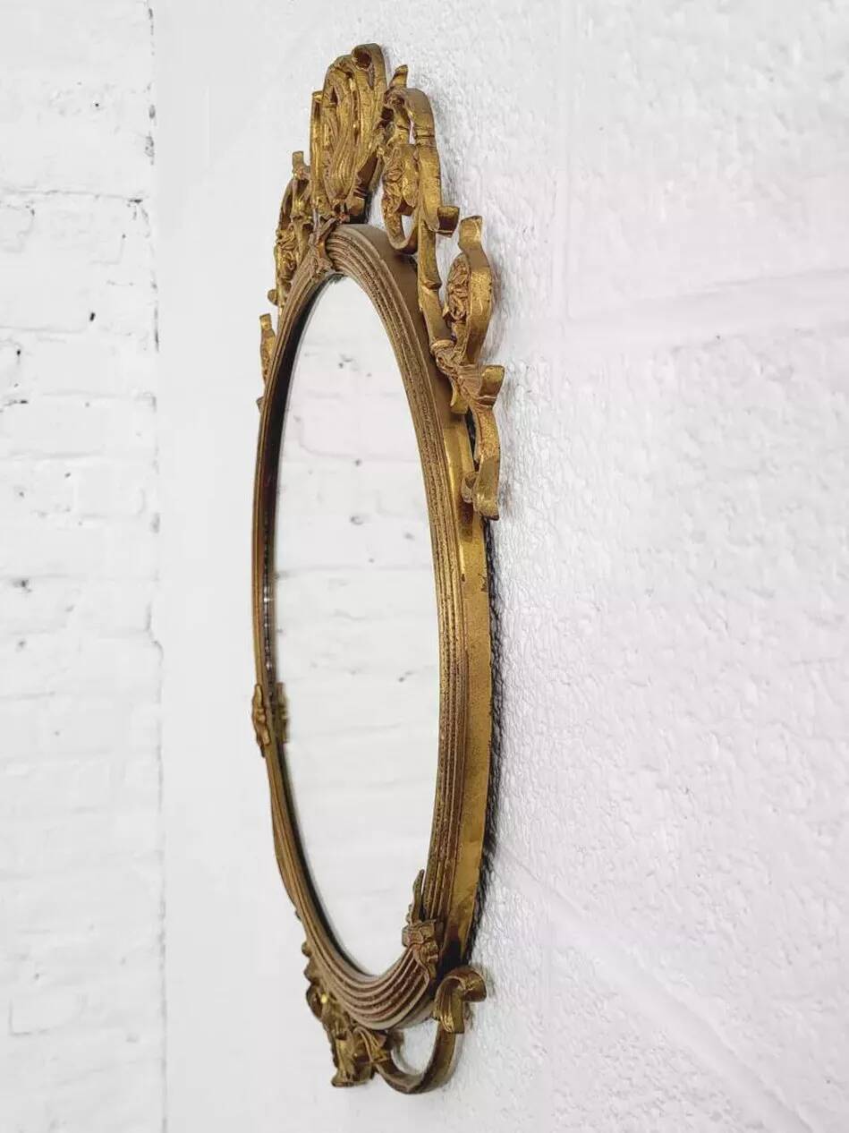 Round brass medallion style mirror