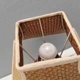 Very rare table lamp in turned teak wood with original braided shade. 1970s