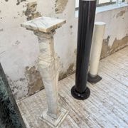 Set of 4 marble columns or pedestals.