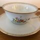 2 porcelain teacups and under teacups floral motifs