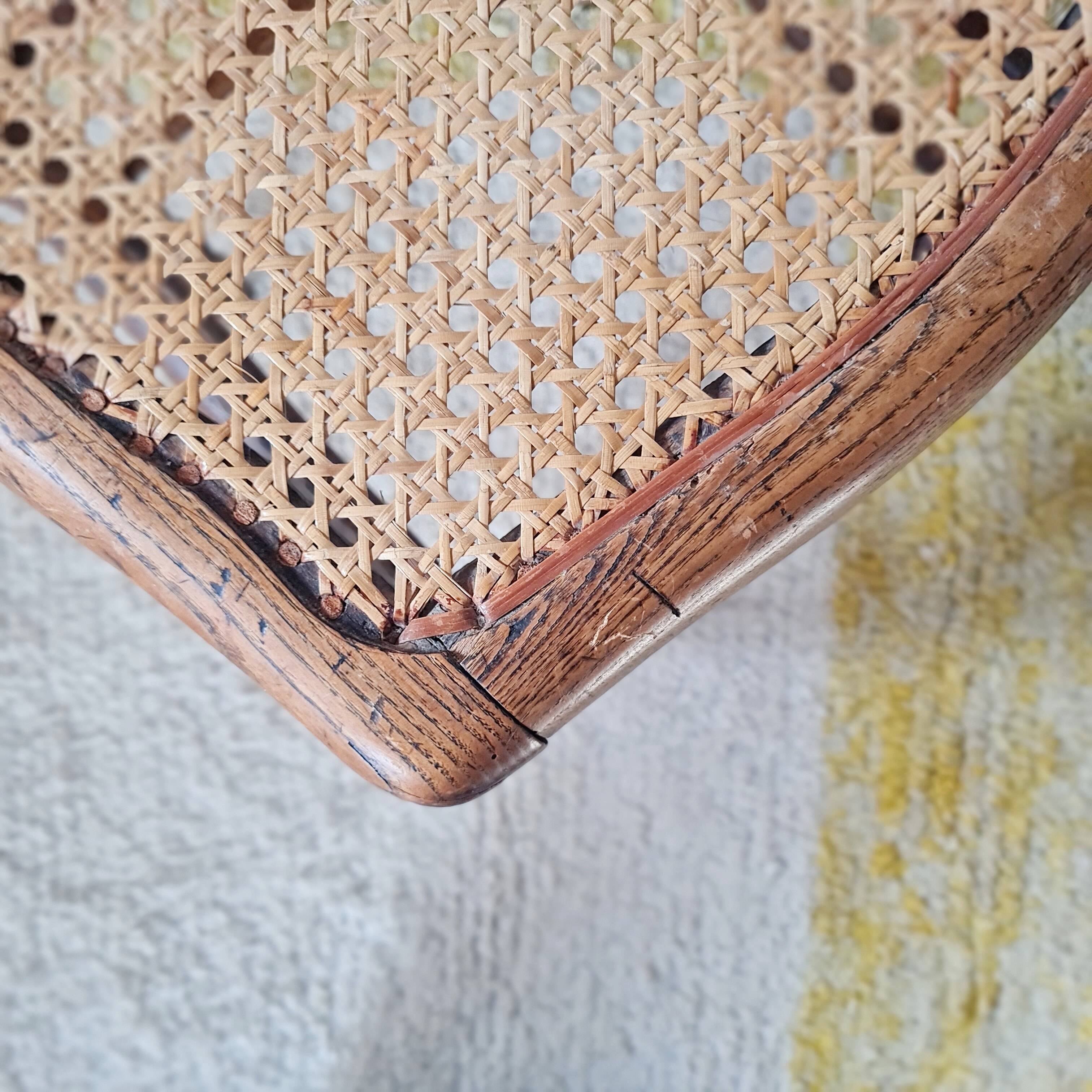 Wooden stool with cane seat