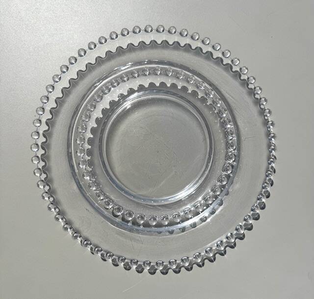 Head to head of crystal plates, Andlau model, signed Lalique