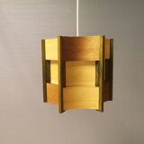 Older lamp in wood veneer, partially painted in green colour.