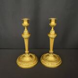 Pair of gilded bronze candlesticks in the Louis XVI style