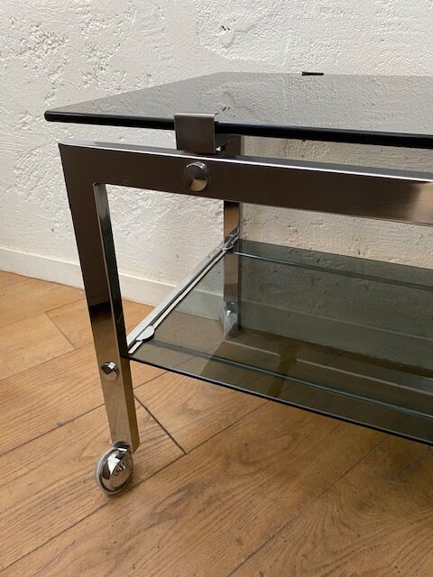 Vintage coffee table on chrome wheel and smoked glass