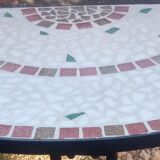 Ceramic half-moon table and wrought iron