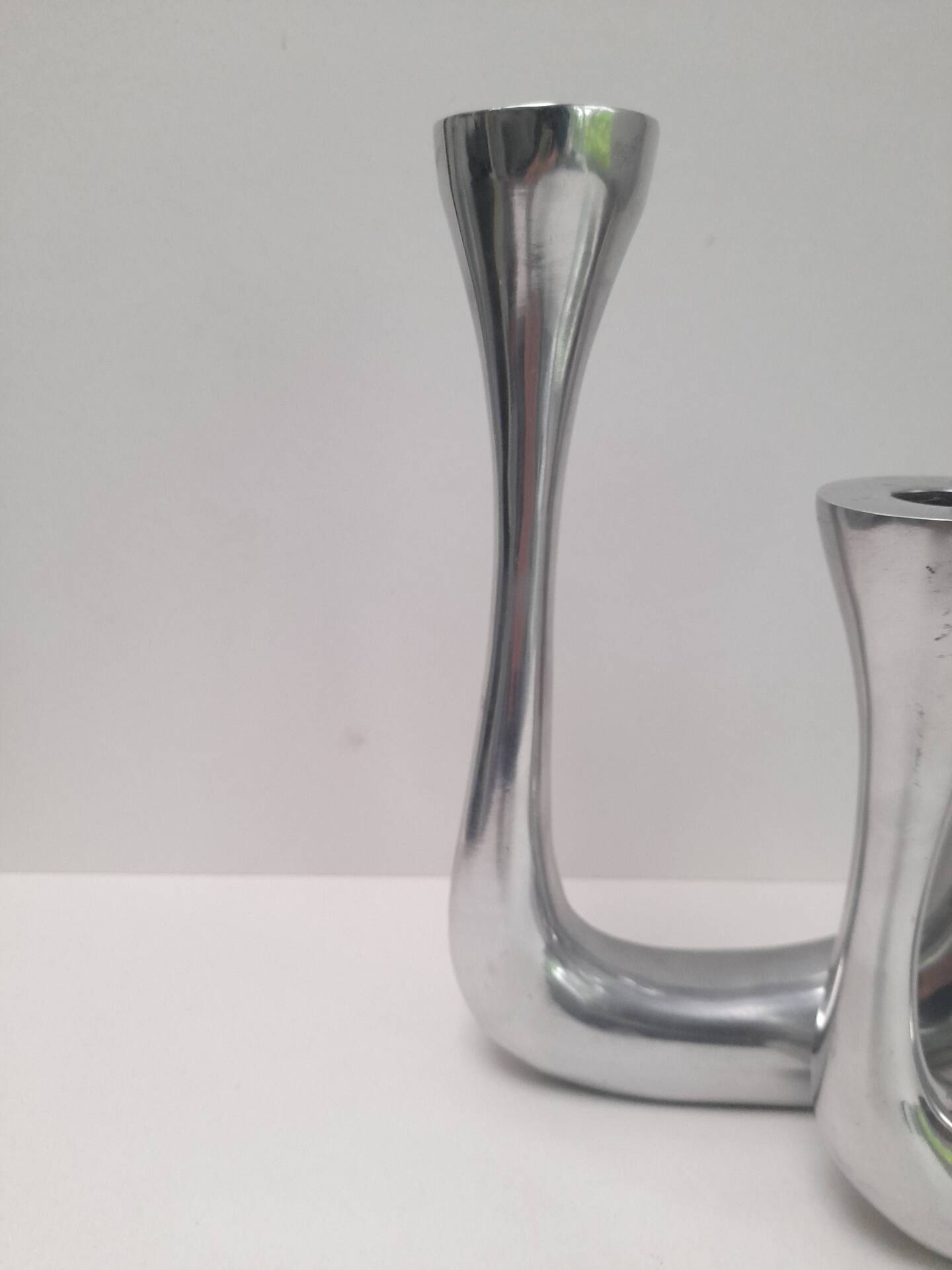 Pair of double candlesticks in aluminium cast iron