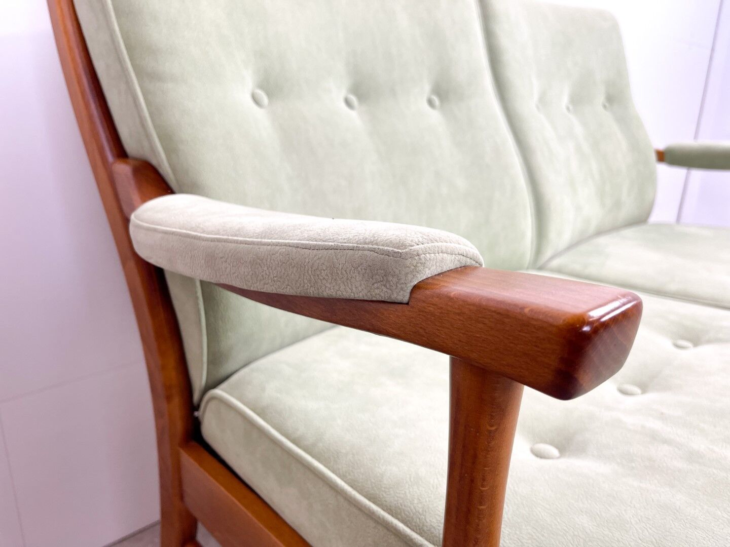 Two-seater sofa from the sixties with green upholstery