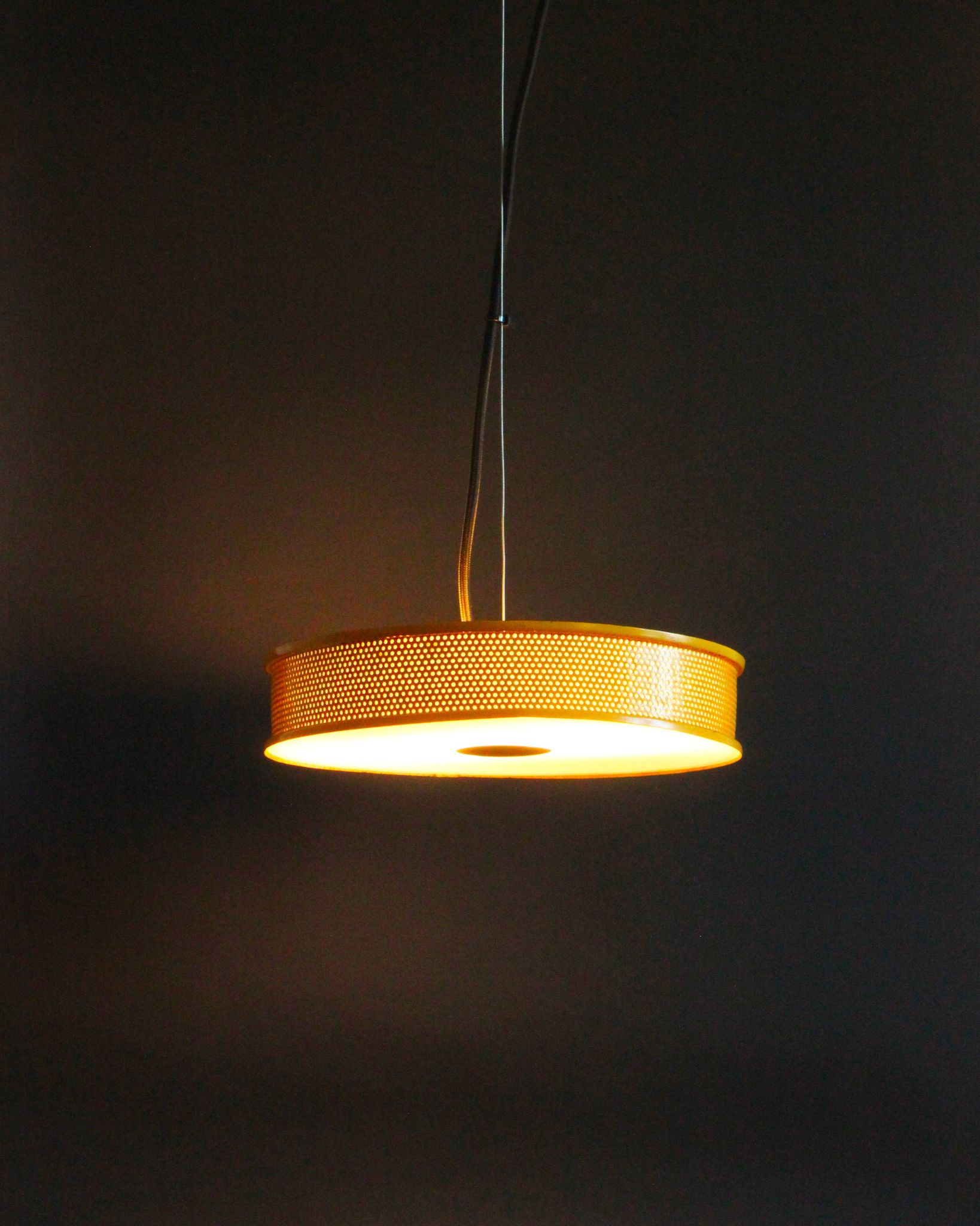 Yellow lacquered perforated metal pendant, in the style of Matégot or Biny.