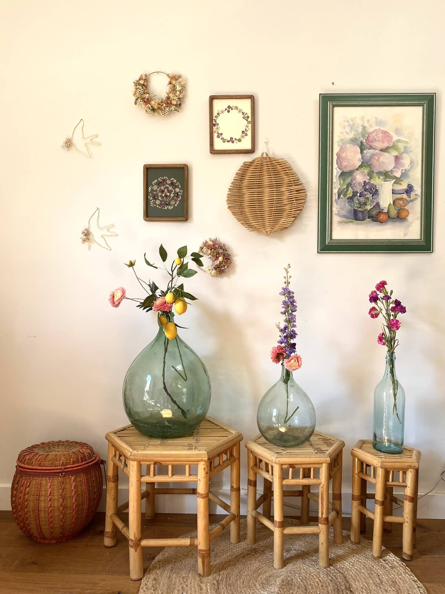 Set of three vintage rattan side tables.