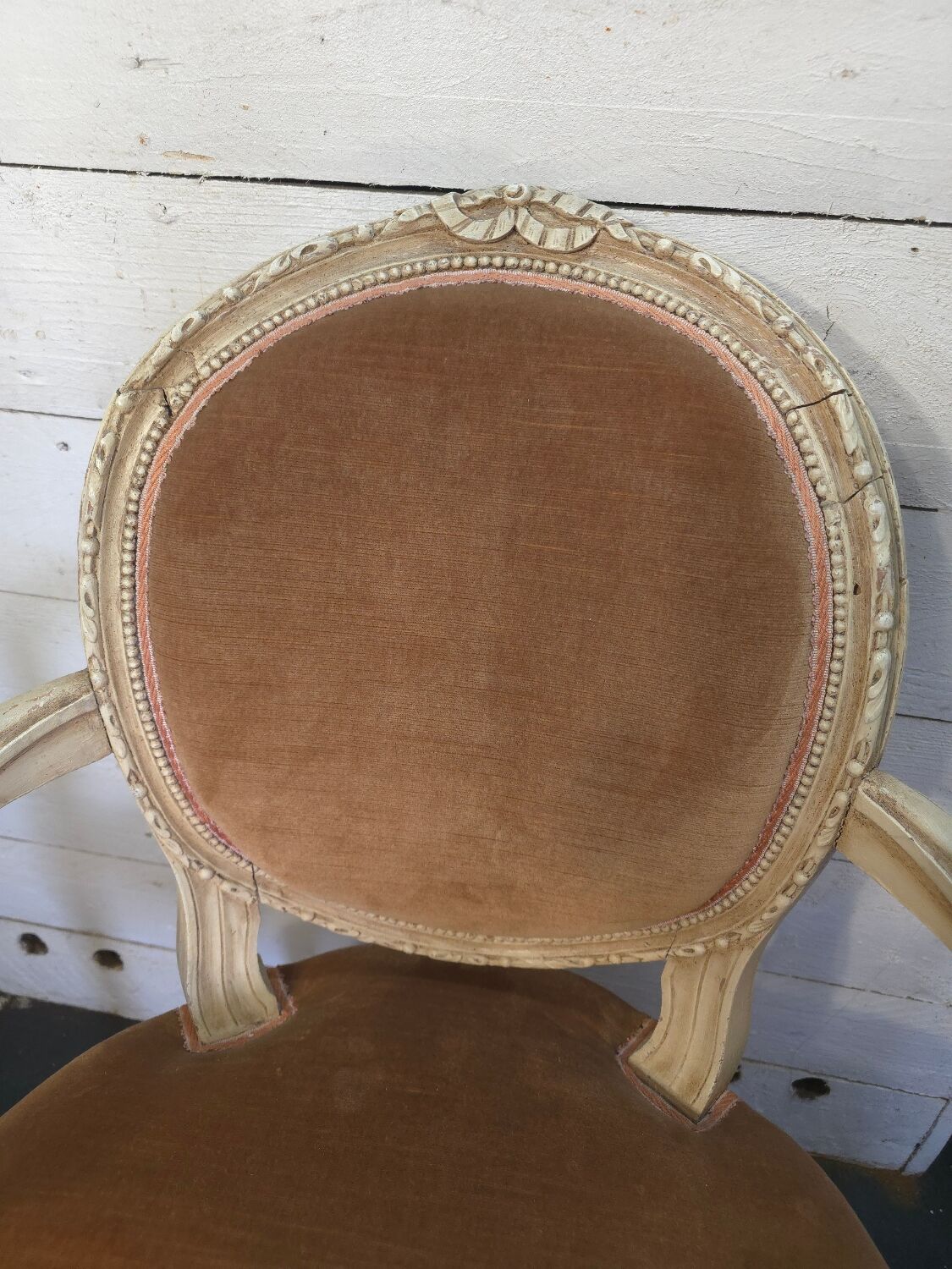 Louis XVI style bergère armchair in patinated wood