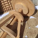 Vintage wooden stool with screws