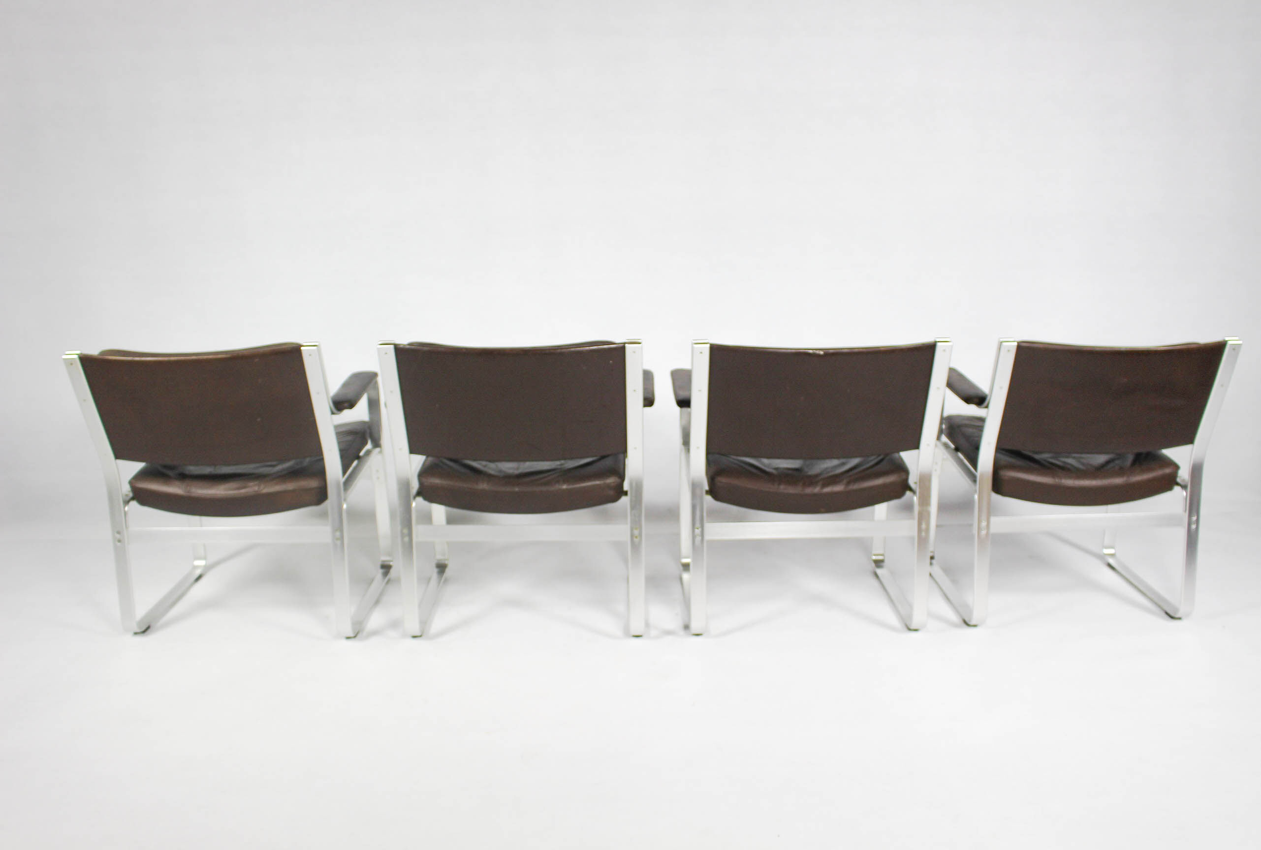 Swedish Mid Century Leather And Aluminum Armchairs By Karl Erik Ekselius For Joc Vetlanda, Set Of 4