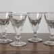 4 antique stemmed wine glasses with flat sides, made of blown glass from the 19th century