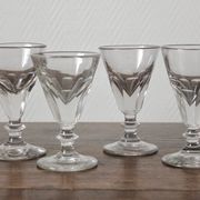 4 antique stemmed wine glasses with flat sides, made of blown glass from the 19th century