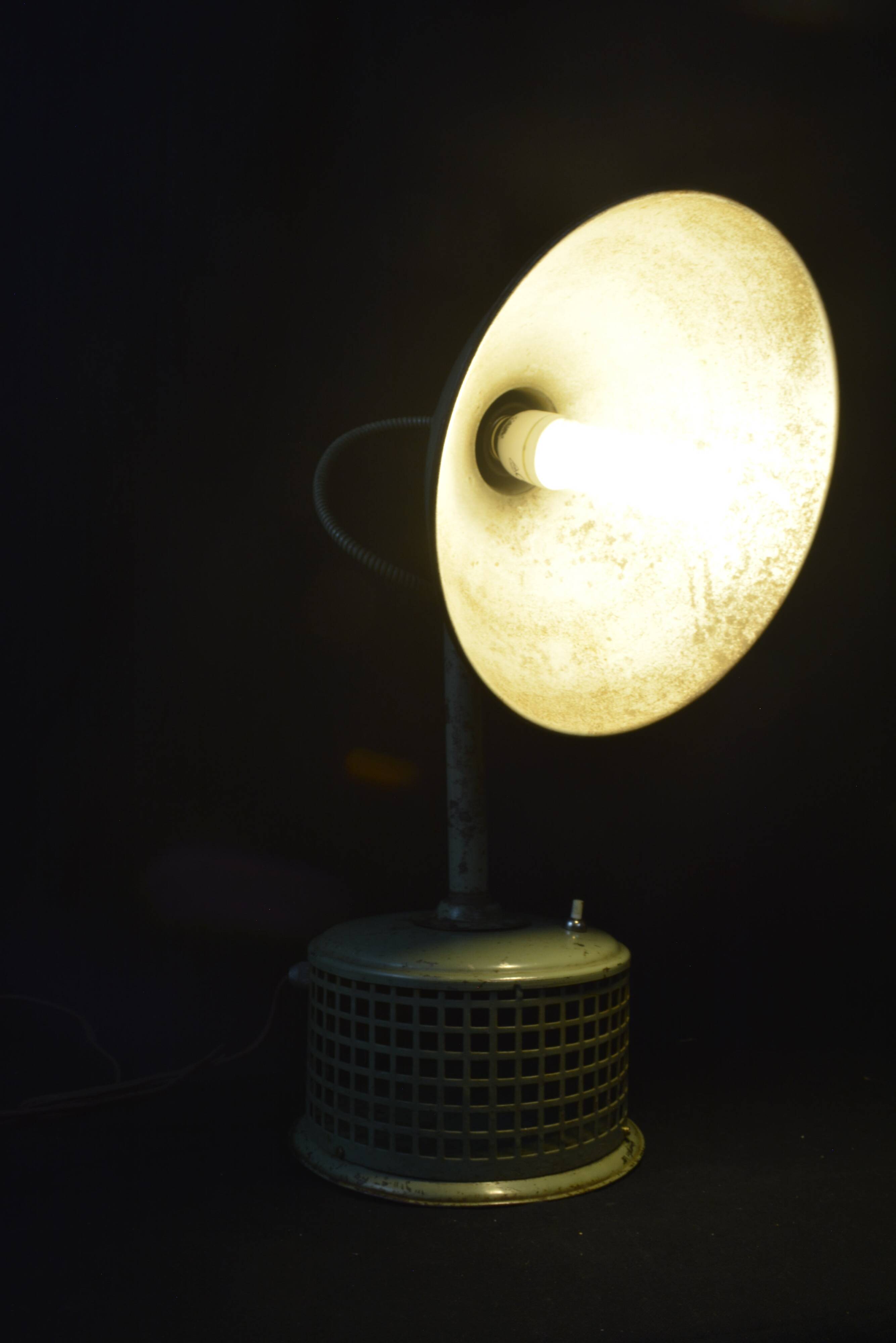 Industrial metal parabola lamp.