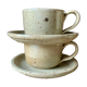Two large Jean Austruy stoneware cups and saucers