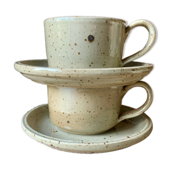 Two large Jean Austruy stoneware cups and saucers