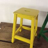 Three wooden stools with a handle