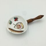 Ceramic aperitif dish and wooden handle.