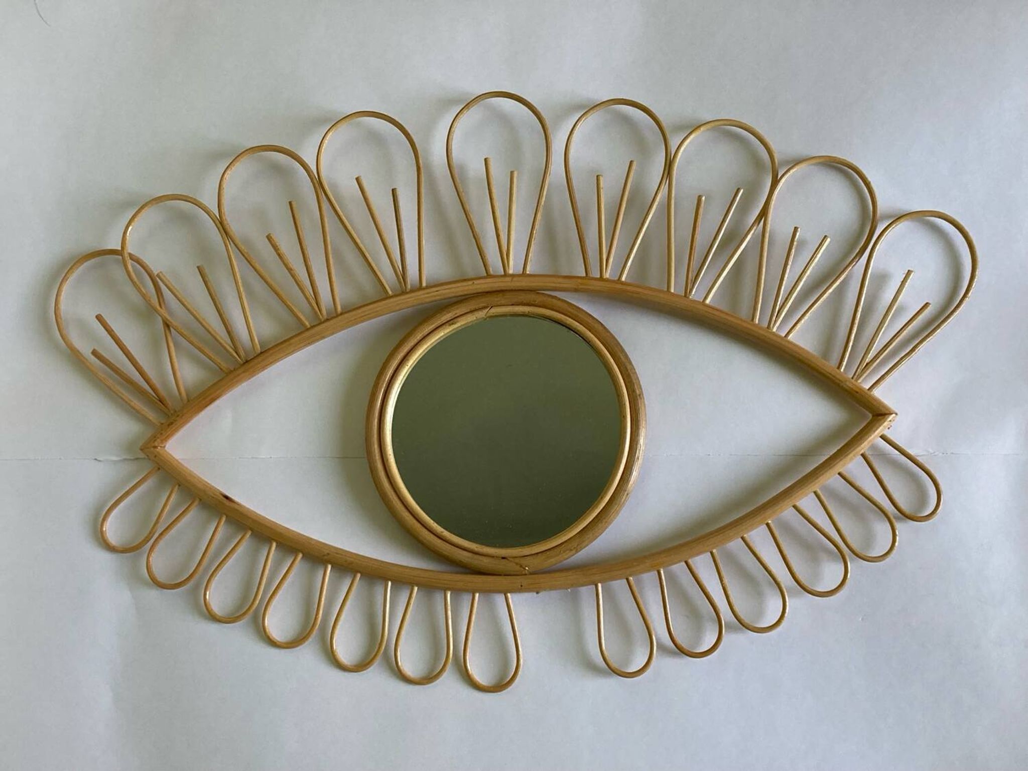 Rattan eye mirror