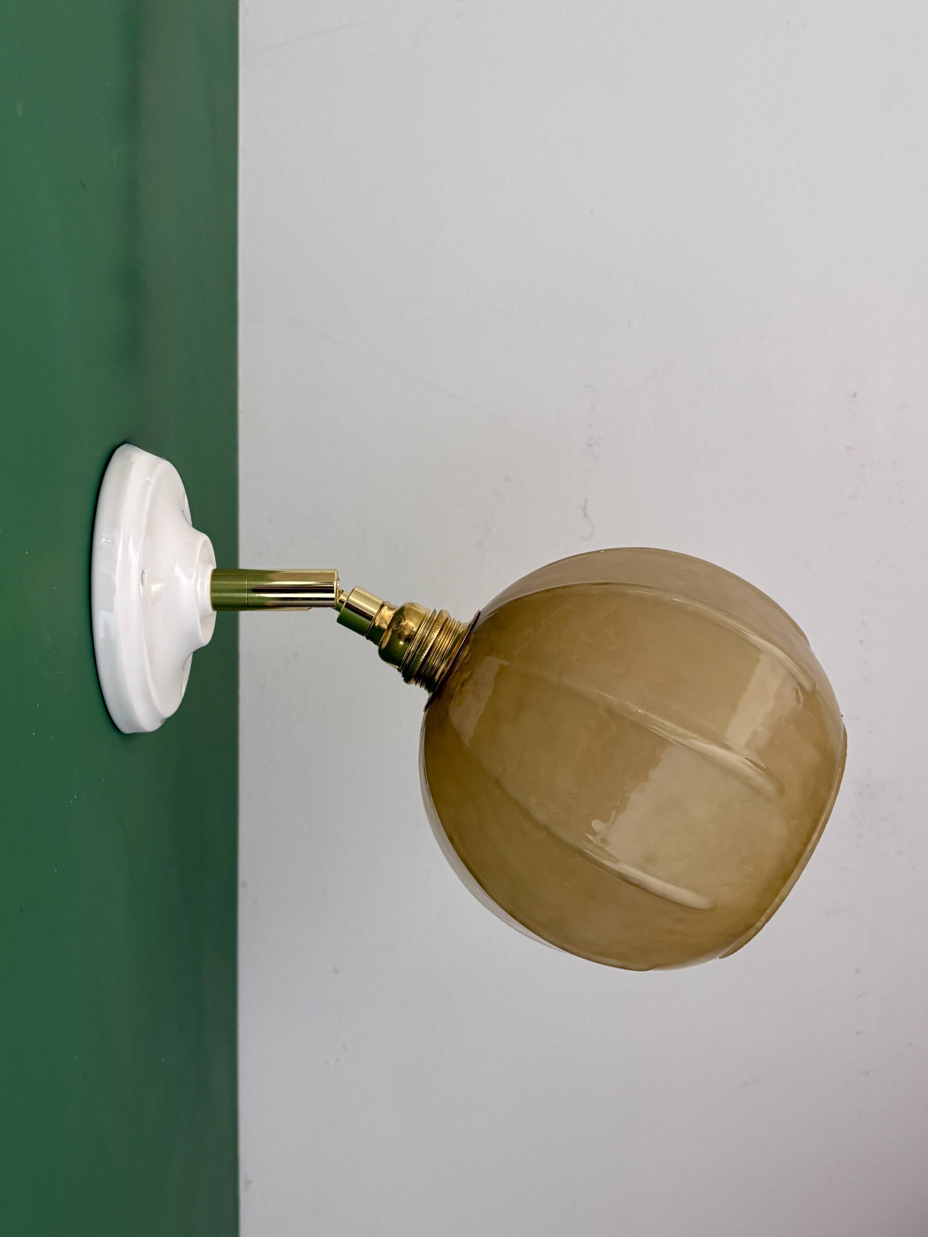 Vintage yellow glass globe wall light