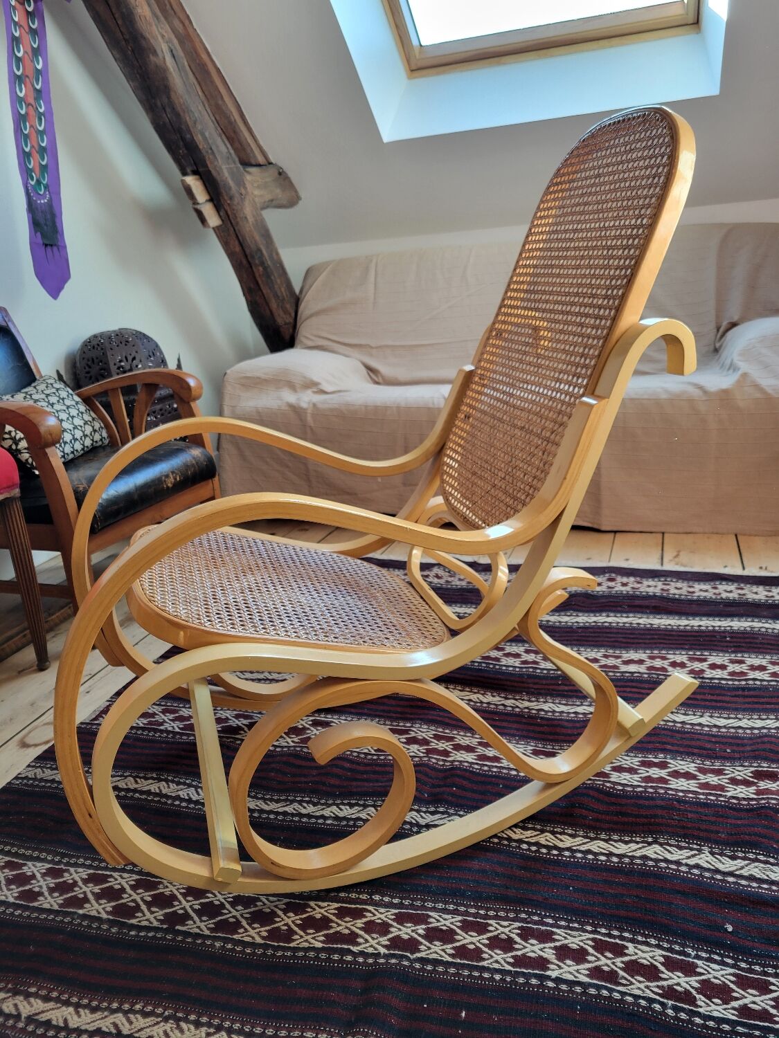 Rocking chair in arched wood and cane