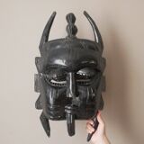 Decorative mask hand carved in tribal ethnic painted wood
