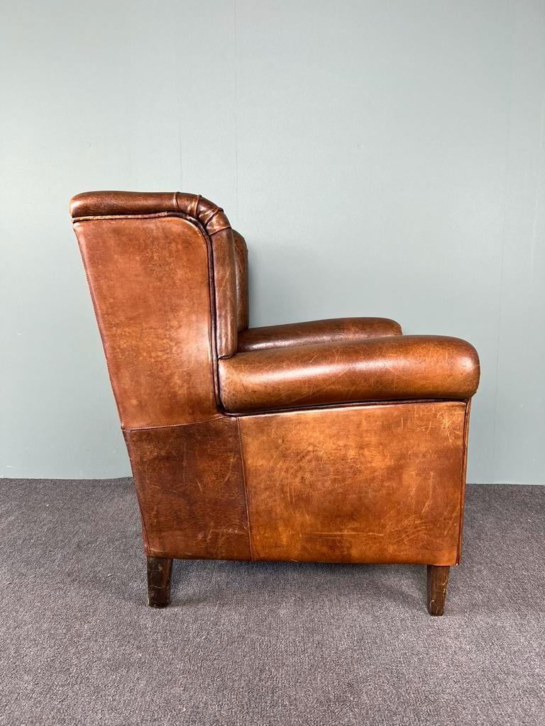 Vintage armchair in patinated sheep leather