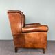 Fauteuil vintage en cuir de mouton patiné