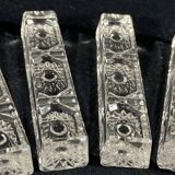 Set of 12 molded glass or crystal knife rests with diamond point decor