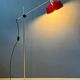 Adjustable red floor lamp in the style of Hoogervorst.