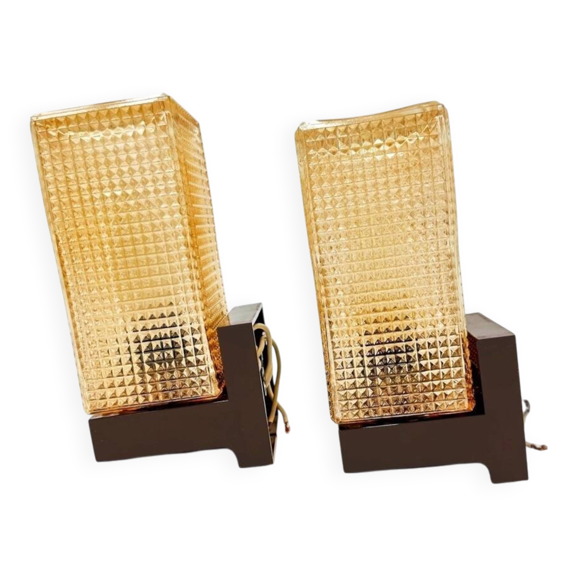 Pair of wall sconces with textured amber glass and Bakelite from the 70s.