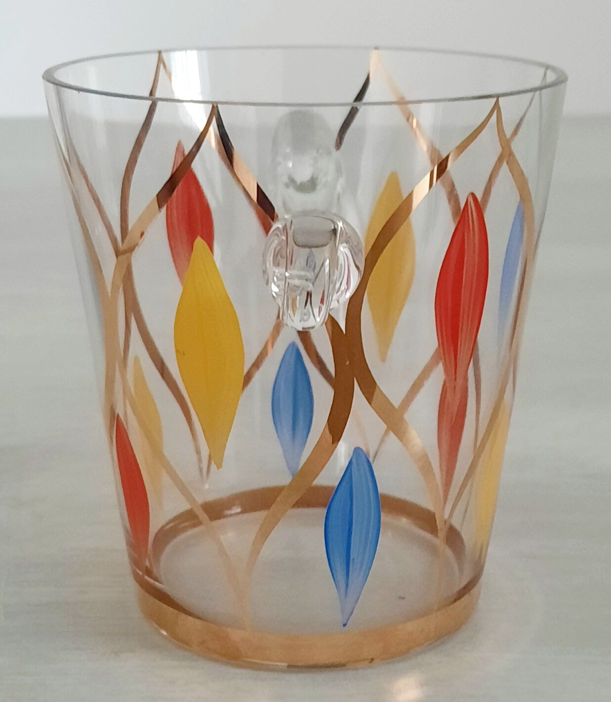 Glass ice bucket, metal spoon and vintage bakelite