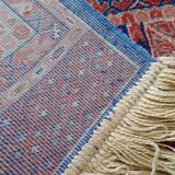 Tapis d’Orient bleu rouge avec franges