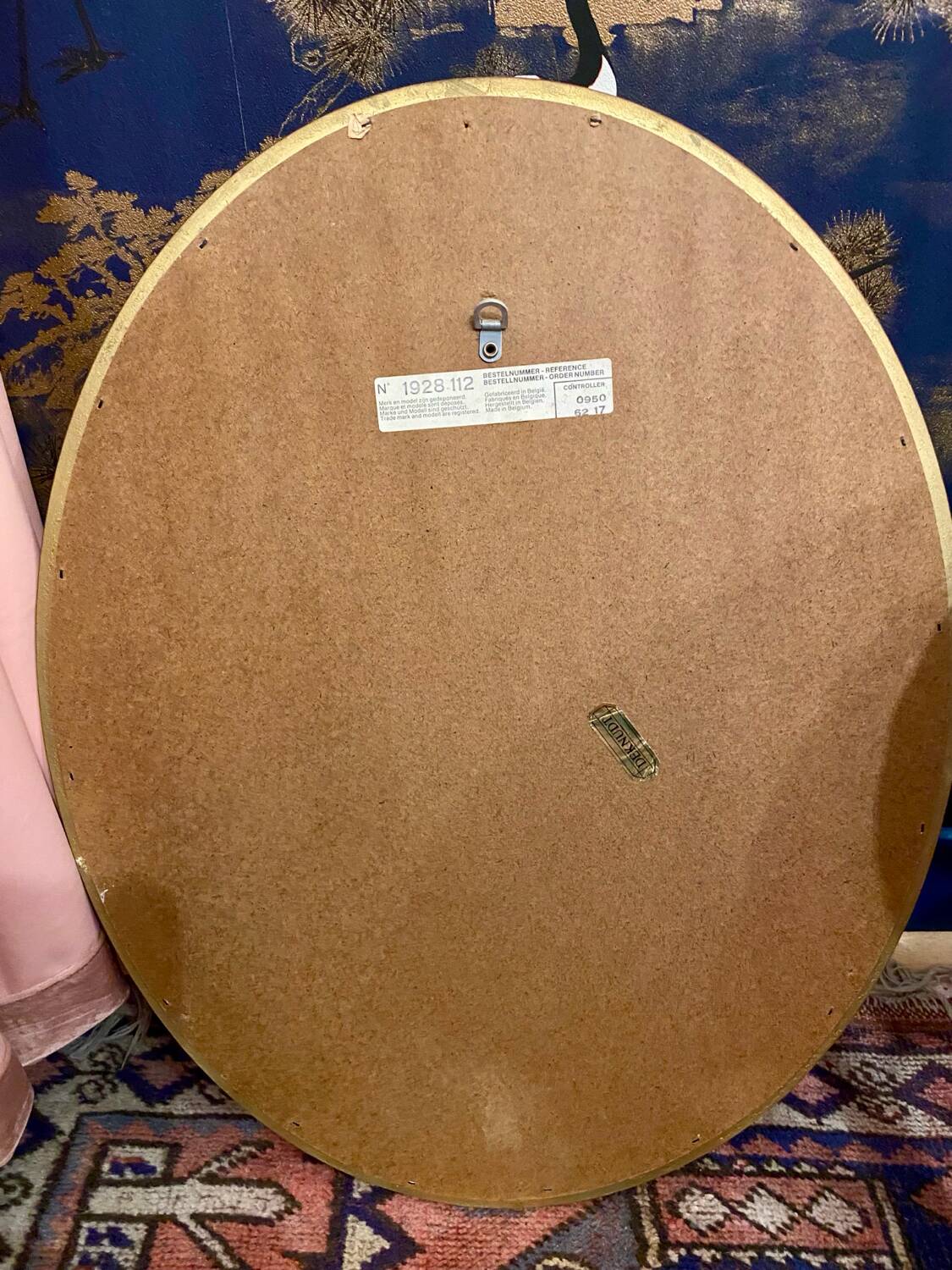 Miroir Deknudt ovale cadre doré.