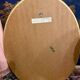 Deknudt oval gold frame mirror.