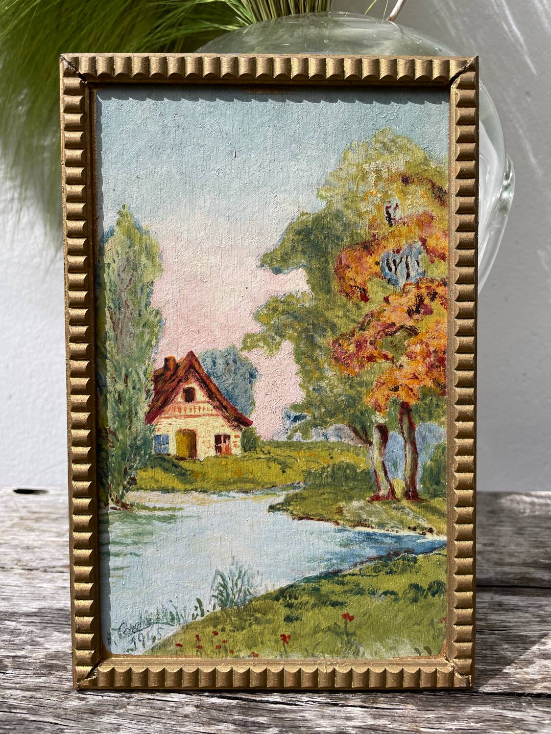 Small landscape painting with golden frame