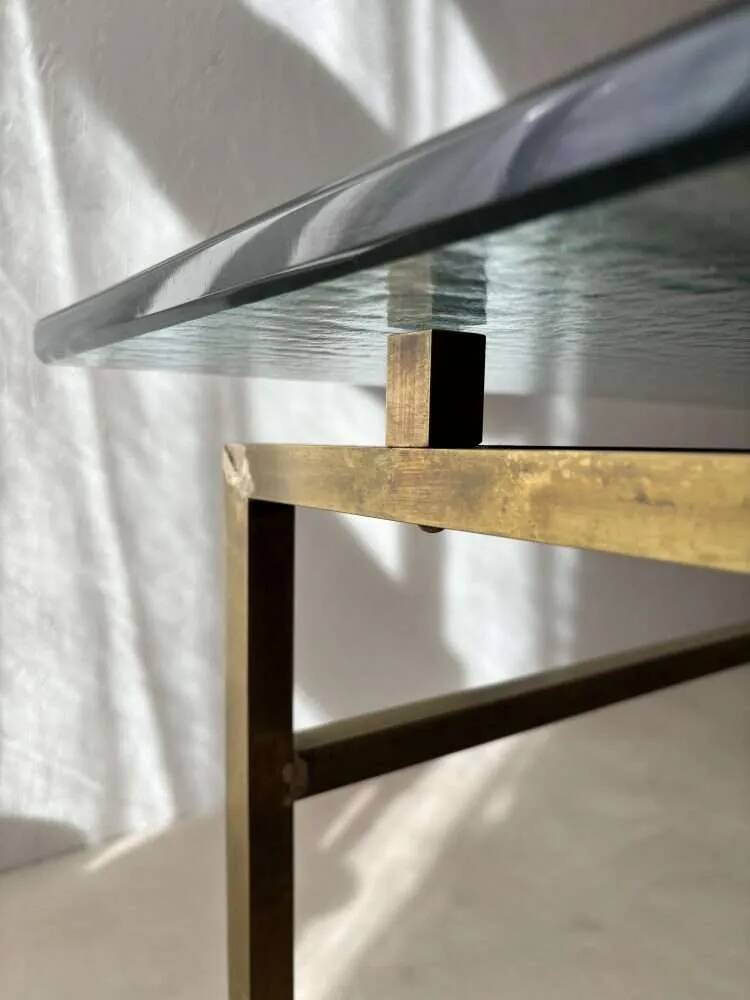 Swedish brass coffee table with a marbled glass top from the 1960s.