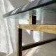 Swedish brass coffee table with a marbled glass top from the 1960s.
