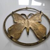 Brass trivet depicting a butterfly