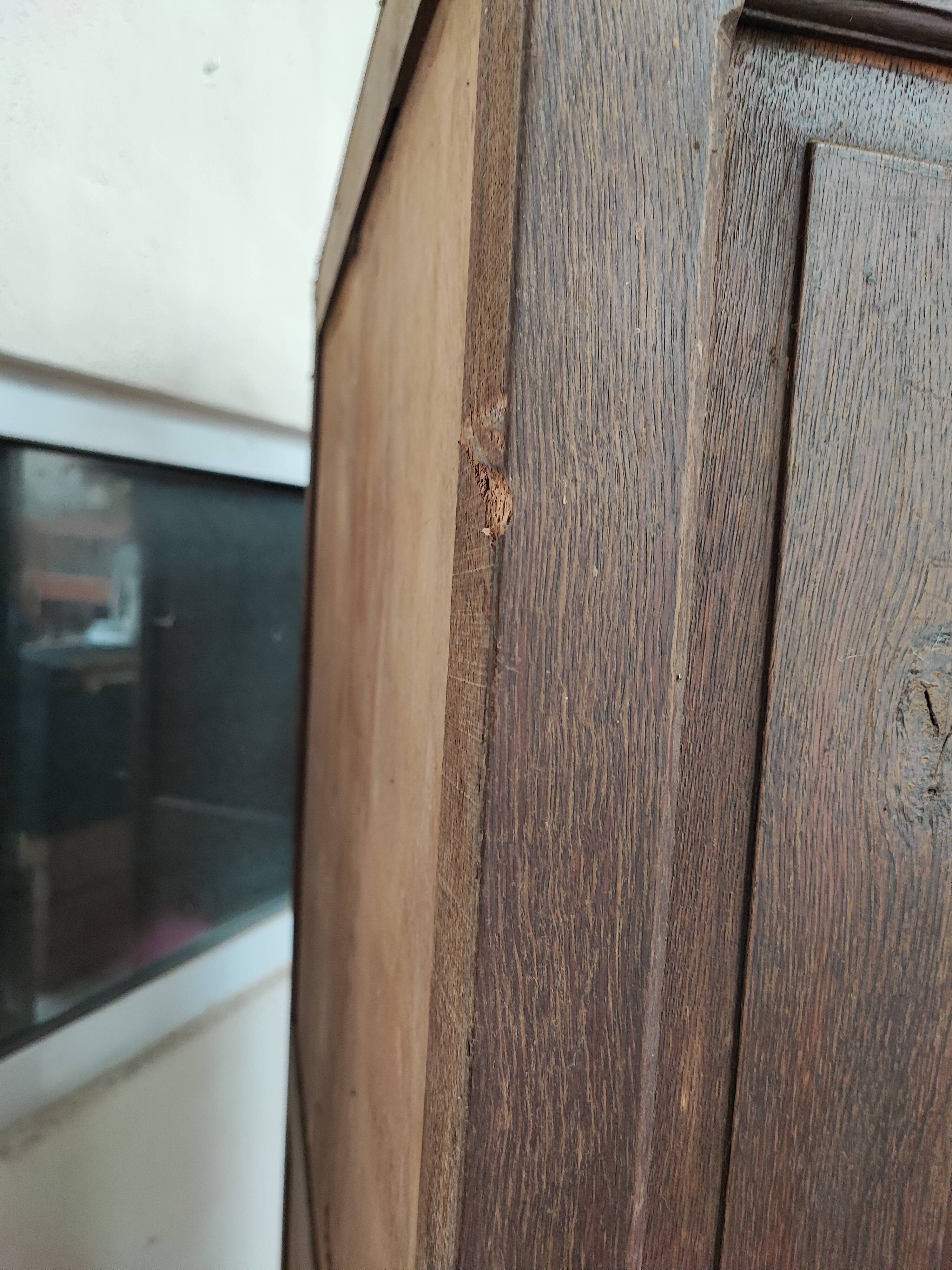 Bonnetière man standing cabinet a door