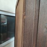 Bonnetière man standing cabinet a door