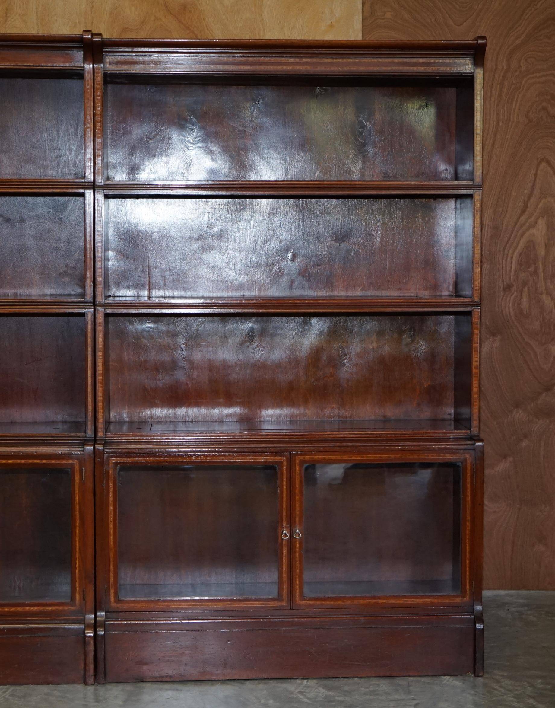 Antique pair of legal bookcases by William Baker Co in hardwood, satin and walnut.