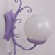 Wrought iron wall lights and glass spheres x2